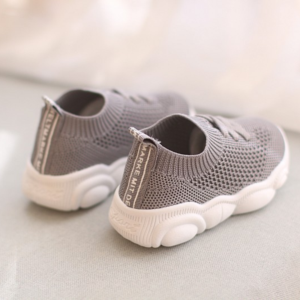 Pair of breathable mesh kids sneakers styled for playground and outdoor adventures