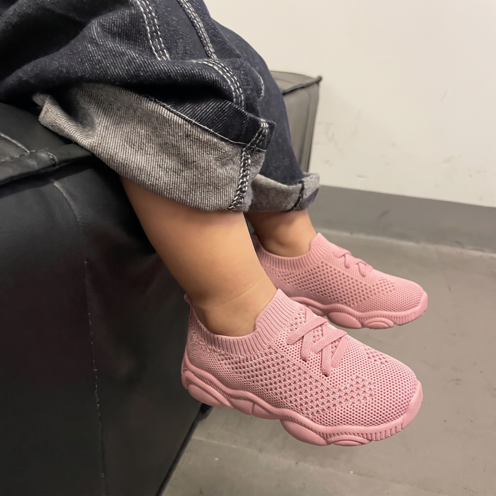 Side view of breathable mesh kids sneakers with flexible sole for active play