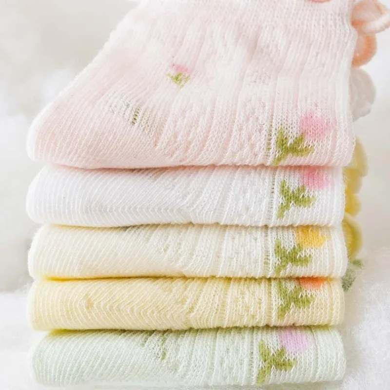 Baby socks 5 pack shown laid out in assorted everyday designs