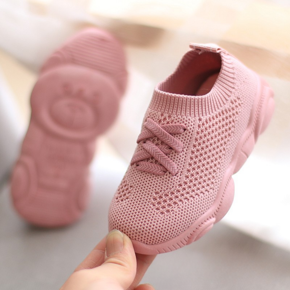 Pair of kids sneakers in breathable mesh with lightweight summer-ready construction