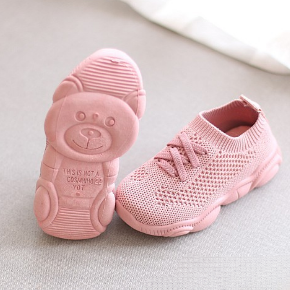 Top view of mesh kids sneakers showing airy fabric and secure fit