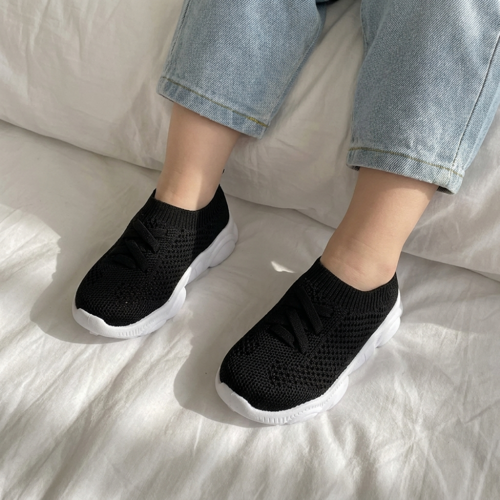 Close-up of breathable mesh material on kids sneakers for cool comfort