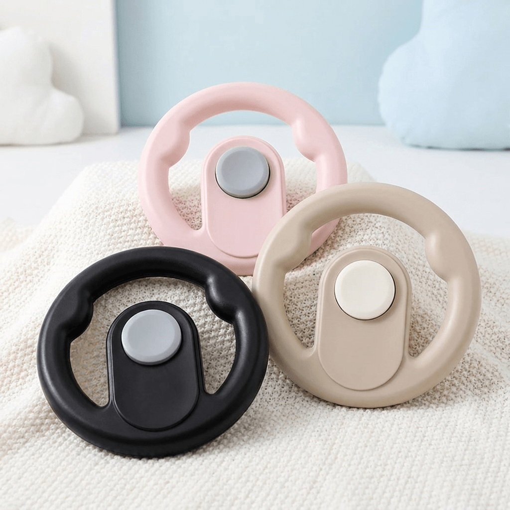 Pram steering wheel toy for toddlers attached to a pram handle